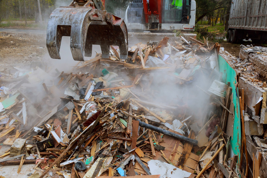 excavator disassembles broken house after tragedy