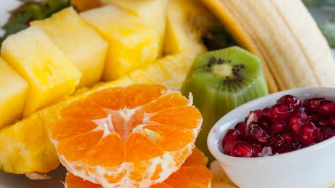 sliced orange fruit on white ceramic bowl