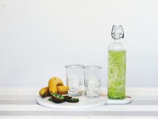 fruit juice and fruits on top of table