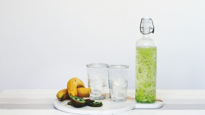 fruit juice and fruits on top of table