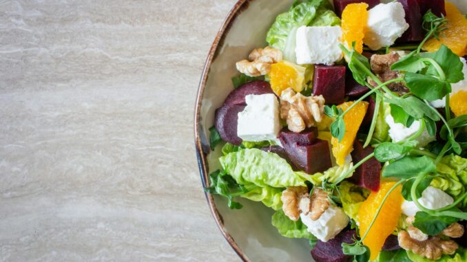 bowl of vegetable salad with walnuts